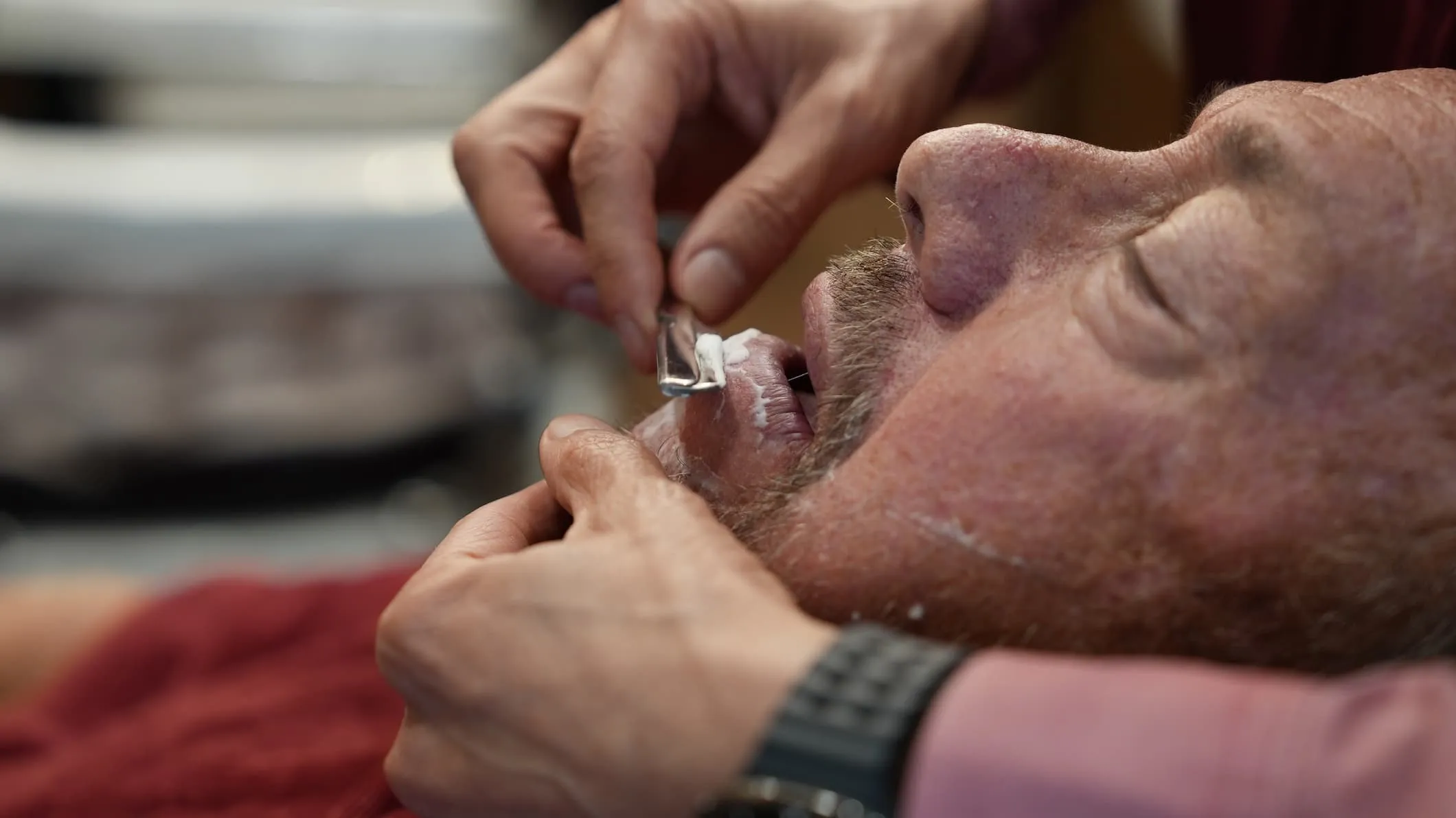 Client enjoying a traditional hot towel shave
