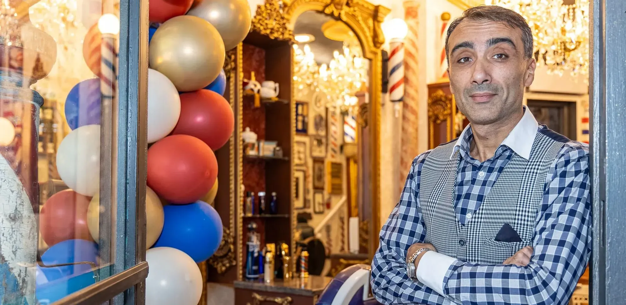 Barber standing in front of the Barber Shop Museum